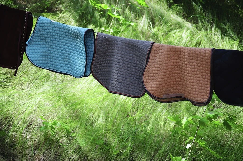 Horse saddle blankets drying outside Horse saddle blankets drying outside